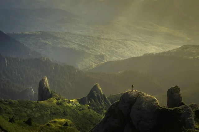 Golden sunlight crossing a mountain valley